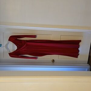 Red women's long dress with high slit.